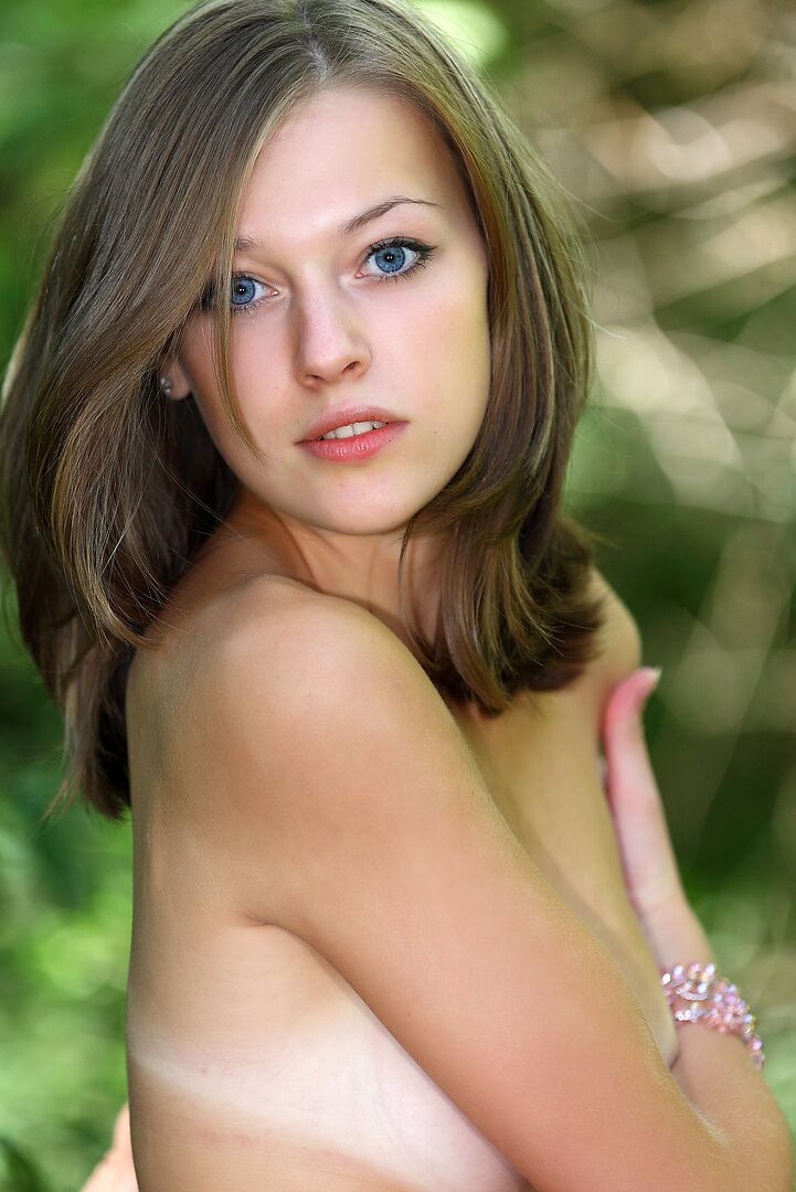 12P Innocent looking teen shows her tan lined body wearing a tutu in the forest
