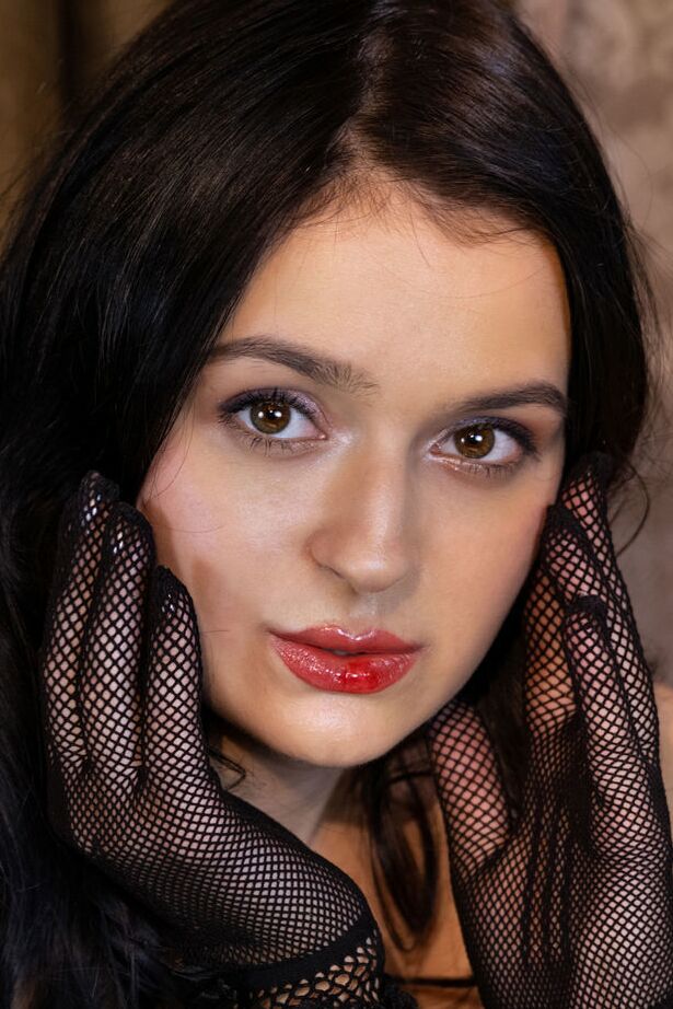 18P Dark haired teen Anthea removes mesh gloves and hosiery to pose nude