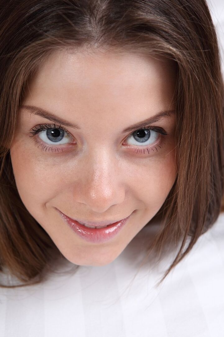 16P Enticing brunette Danica gazes intently as she presents big melons & tight ass