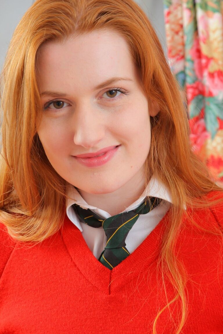 21P Redhead college babe Vasilisa exposes her natural juggs and poses in panties