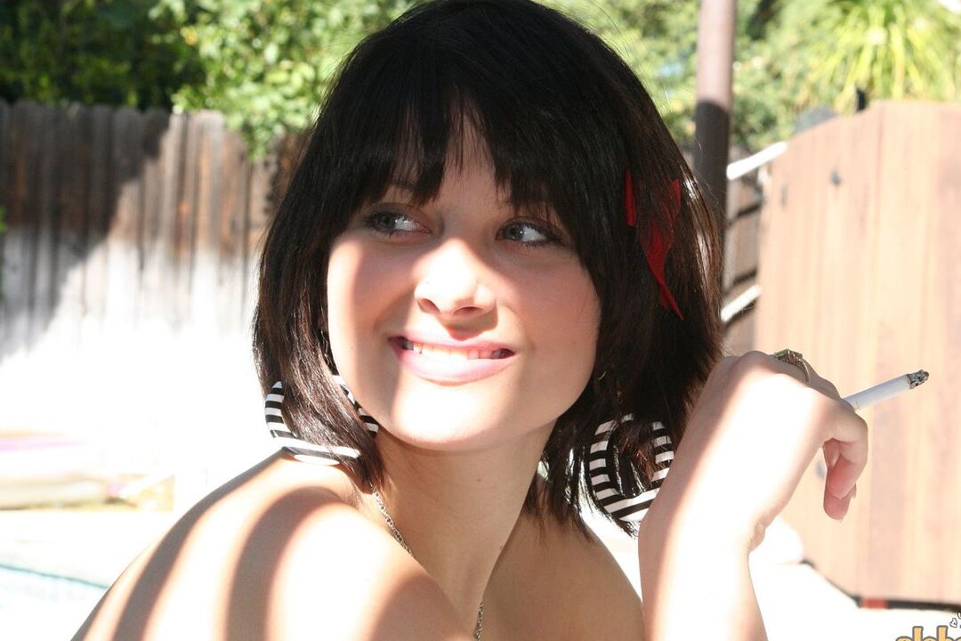 16P Brunette MILF Ellie Idol frees her naked body from bath towel while smoking