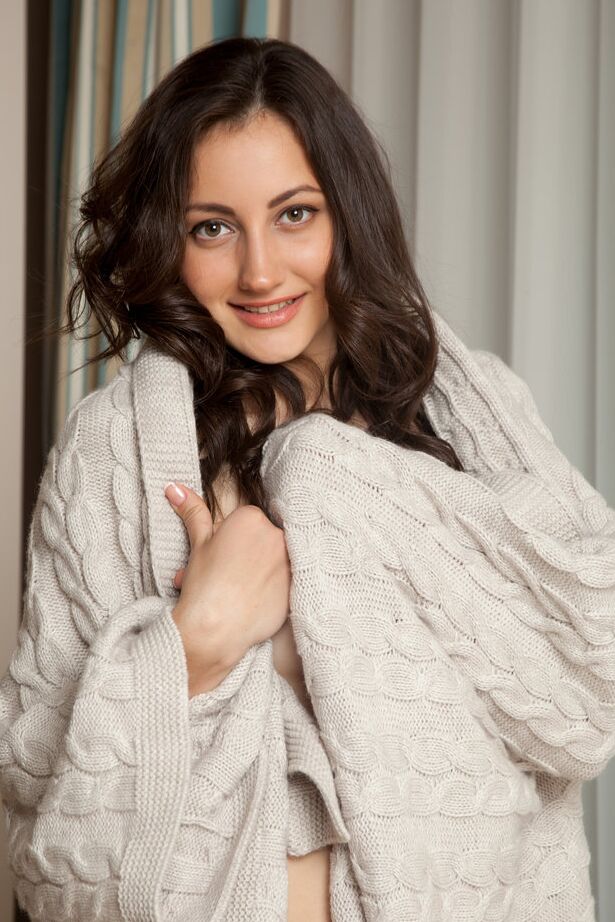 16P Young brunette Gladys ditches her sweater to model in the buff near a window