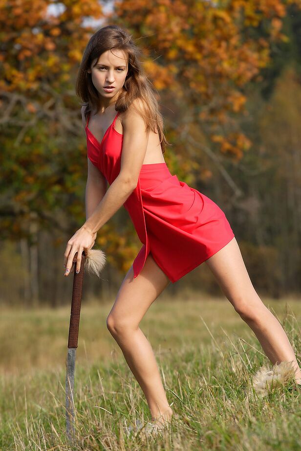 12P Slender teen wields a samurai sword while getting naked in a field