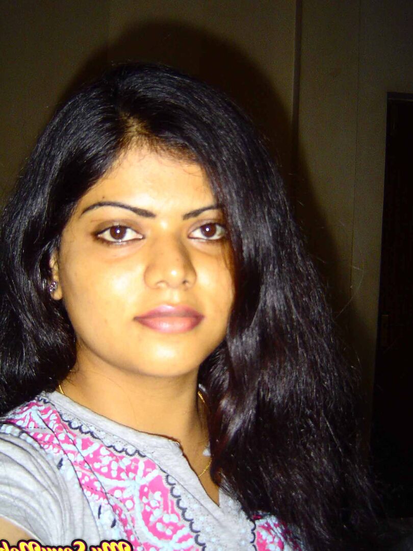 15P Indian woman Neha takes self shots while she holds her face firm