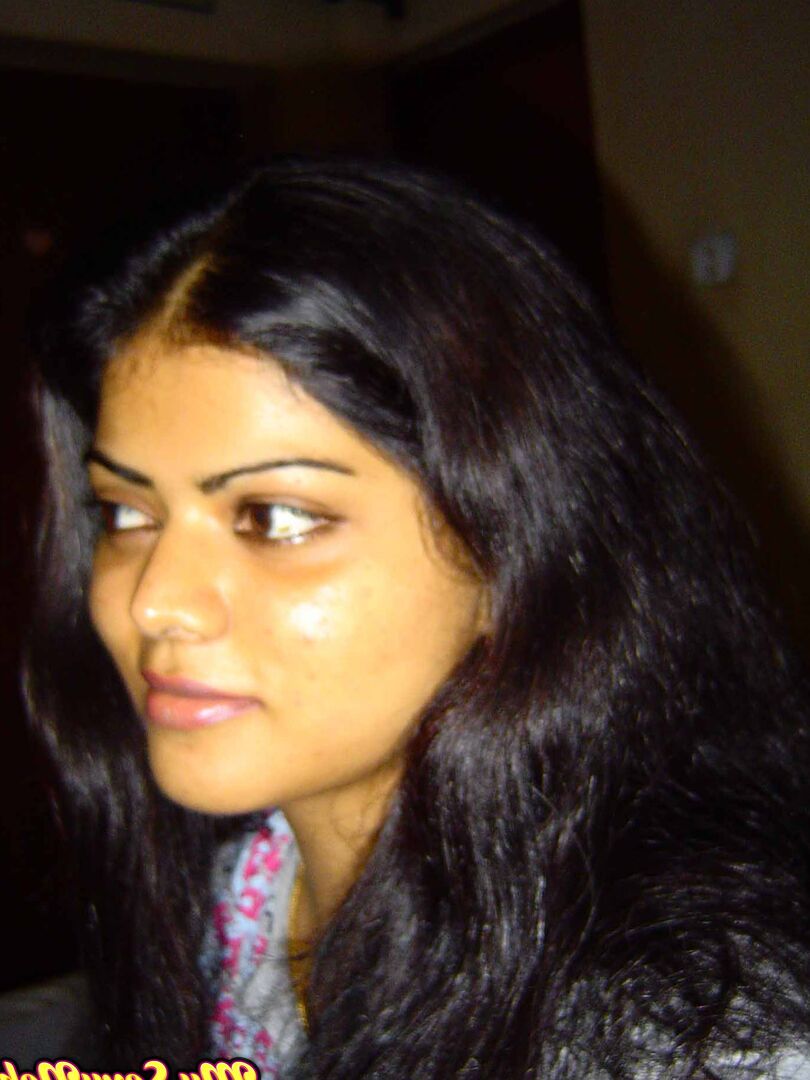 15P Indian woman Neha takes self shots while she holds her face firm