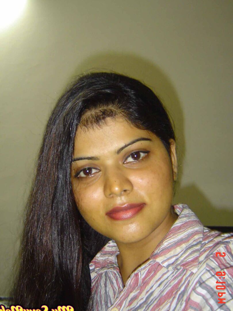 15P Indian woman Neha takes self shots while she holds her face firm