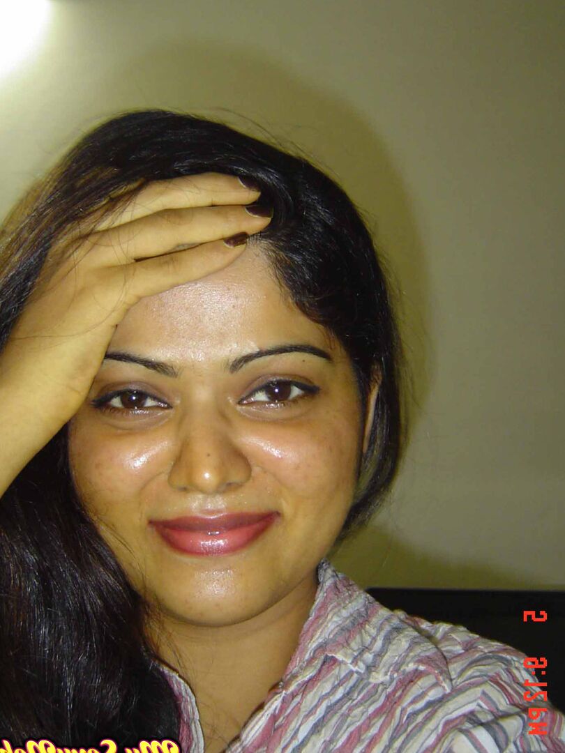 15P Indian woman Neha takes self shots while she holds her face firm