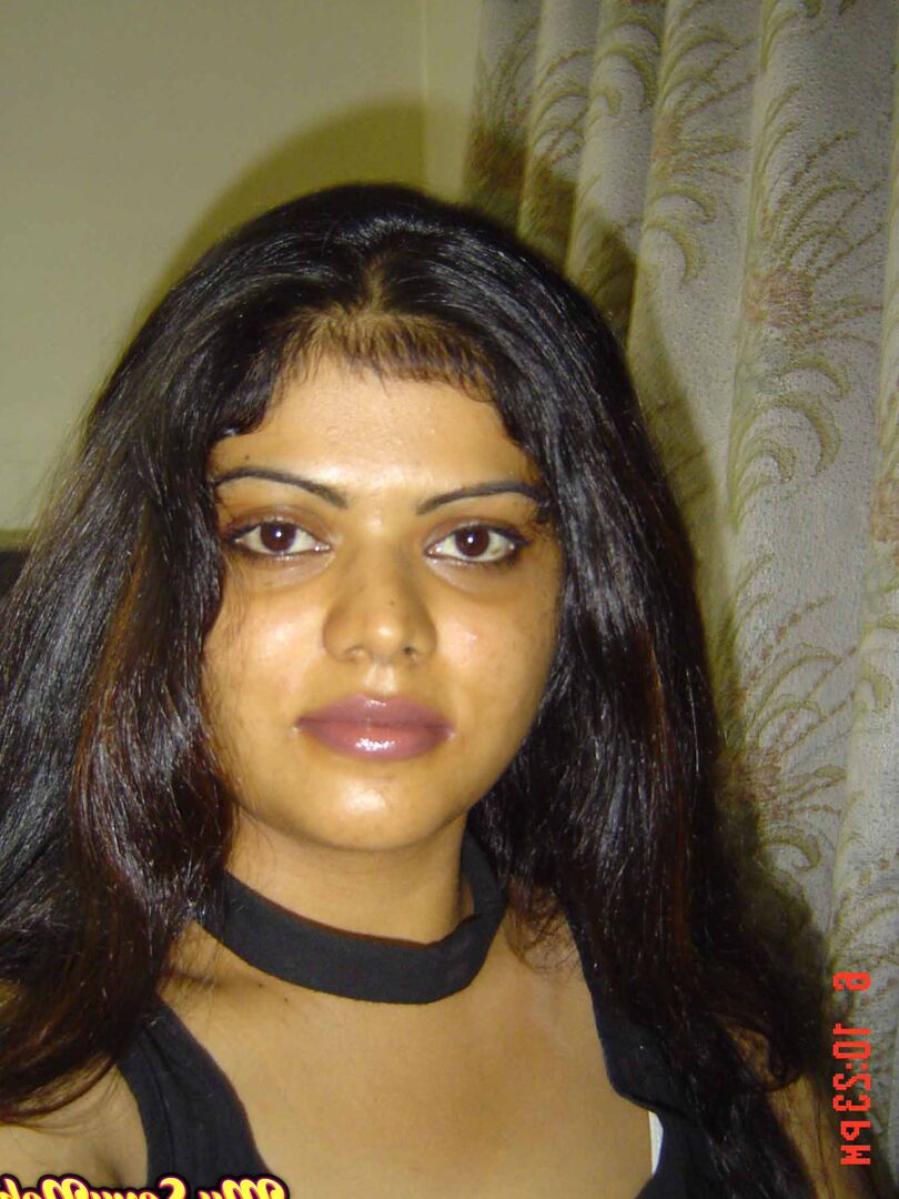 15P Indian woman Neha takes self shots while she holds her face firm