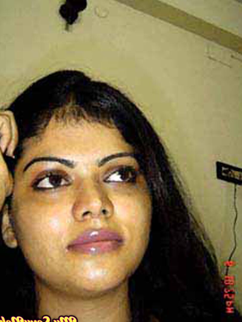 15P Indian woman Neha takes self shots while she holds her face firm