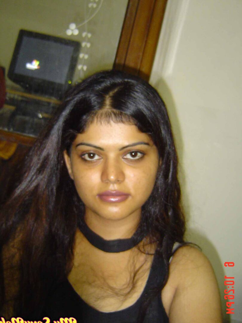 15P Indian woman Neha takes self shots while she holds her face firm