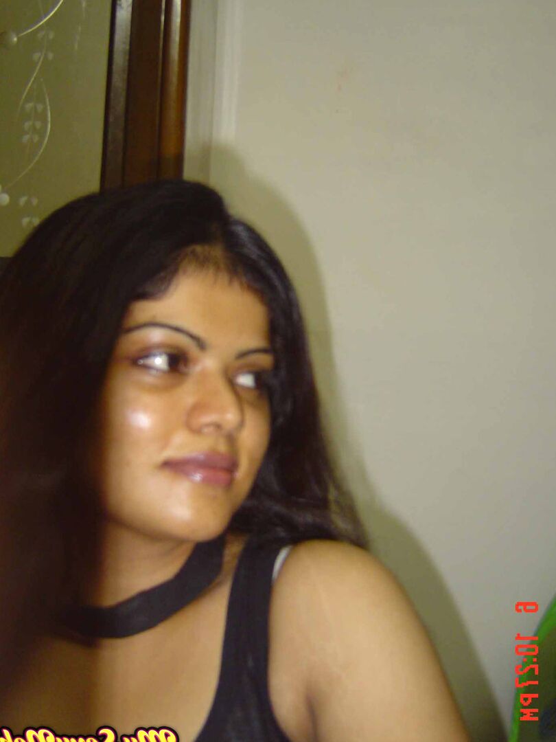 15P Indian woman Neha takes self shots while she holds her face firm