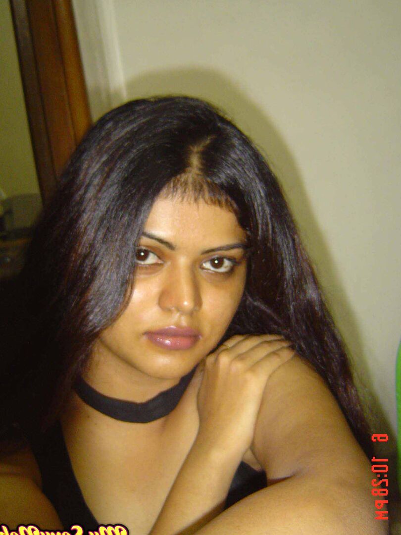 15P Indian woman Neha takes self shots while she holds her face firm