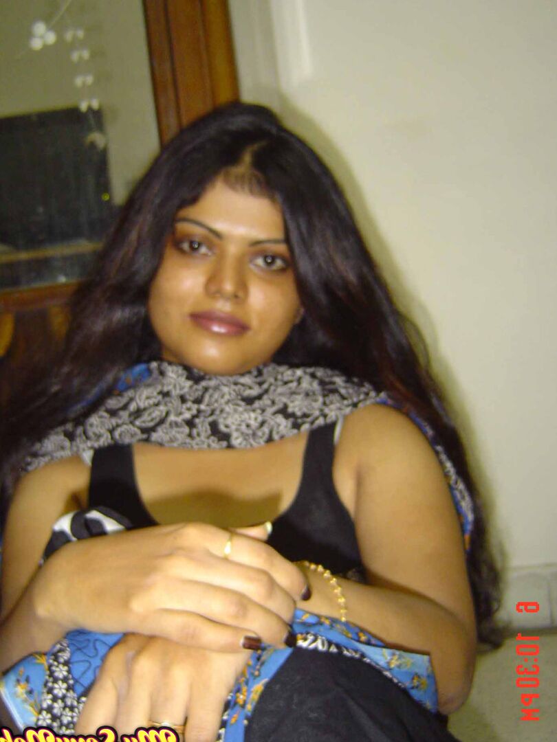 15P Indian woman Neha takes self shots while she holds her face firm