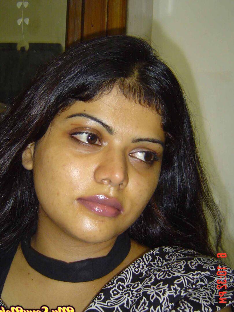 15P Indian woman Neha takes self shots while she holds her face firm