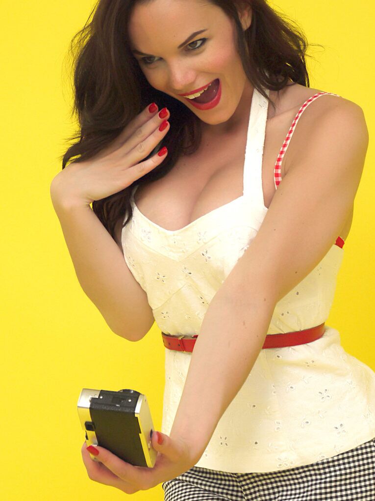 17P Pretty brunette sports red lips while taking self shots as she disrobes