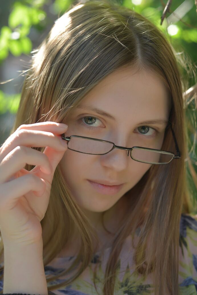 20P Small titted Catalina in glasses posing naked in a field showing bald muff