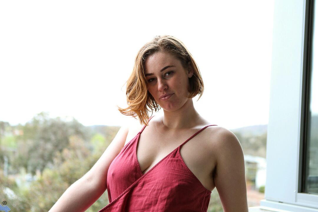 16P Redhead amateur Molly Broad sits on a dildo after getting naked