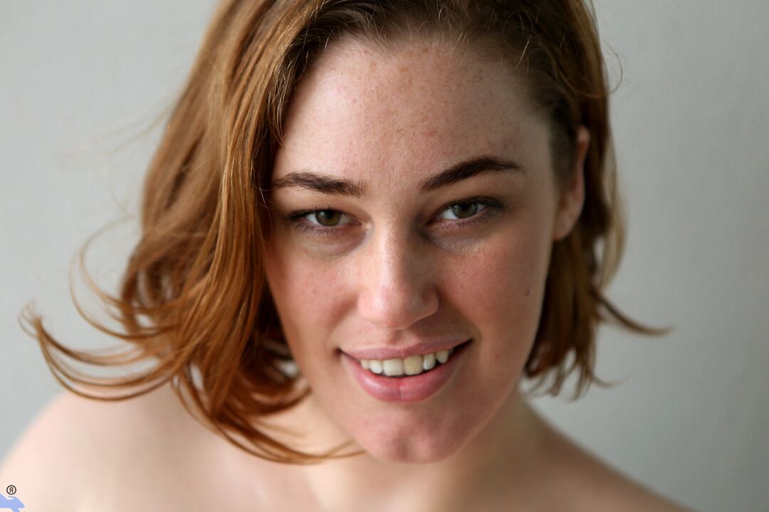 16P Redhead amateur Molly Broad sits on a dildo after getting naked