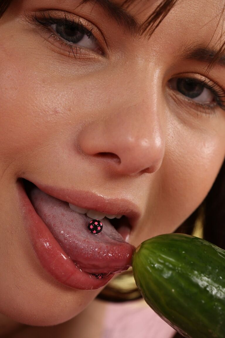 21P Kinky teen with small tits Luna Rival plays with a cucumber on a bed