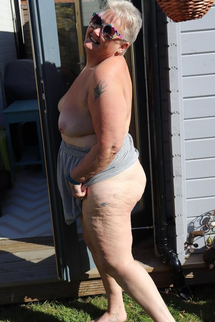 20P Fat nan Valgasmic Exposed plays with her boobs in the backyard while barefoot