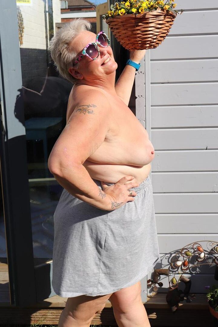 20P Fat nan Valgasmic Exposed plays with her boobs in the backyard while barefoot