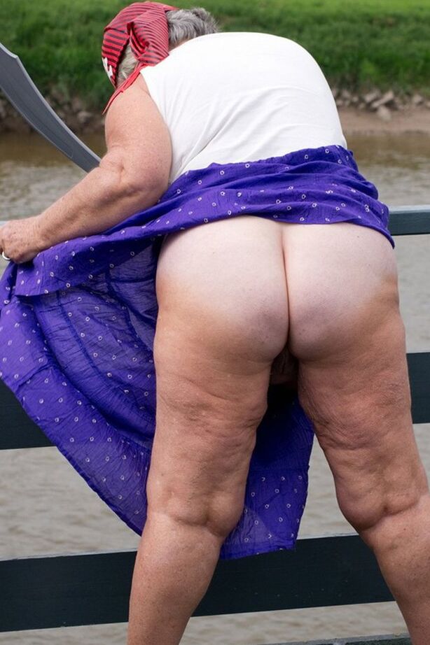 20P Fat British granny exposes herself on a bridge while sporting pirate attire