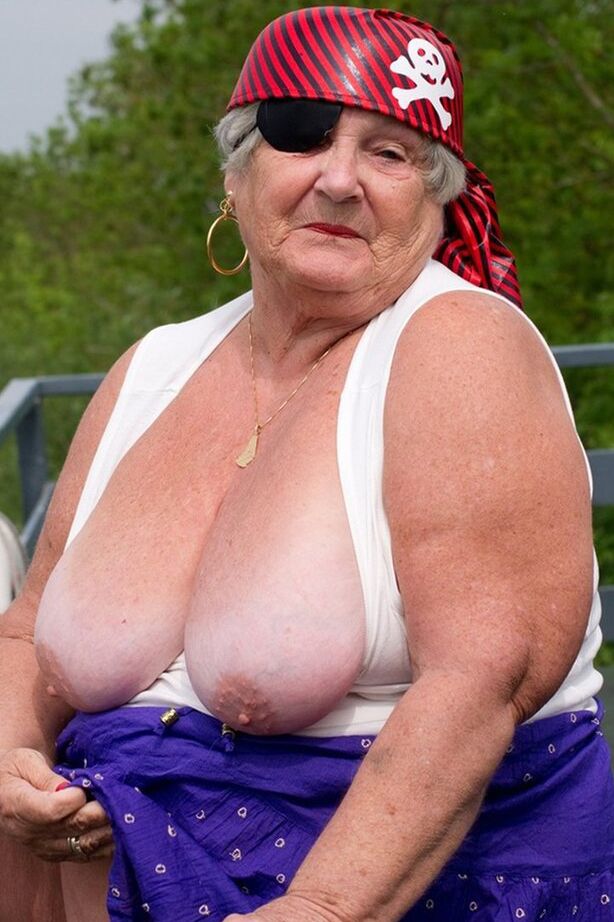 20P Fat British granny exposes herself on a bridge while sporting pirate attire