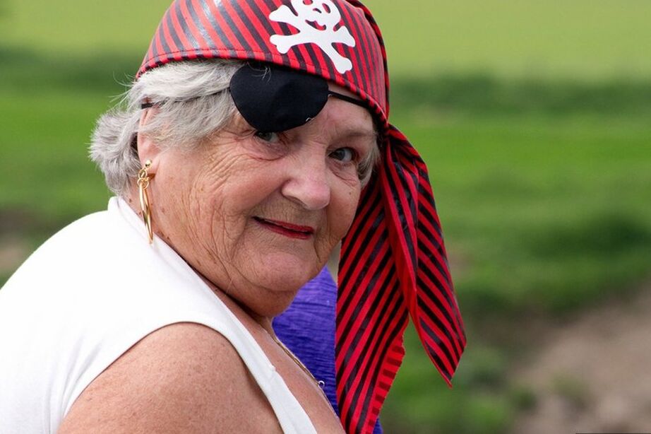 20P Fat British granny exposes herself on a bridge while sporting pirate attire