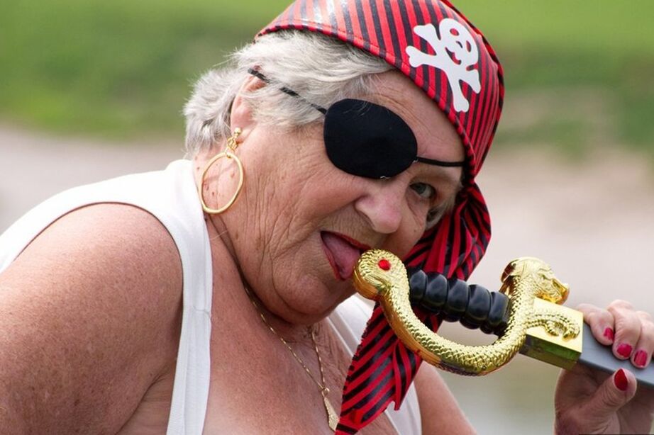 20P Fat British granny exposes herself on a bridge while sporting pirate attire