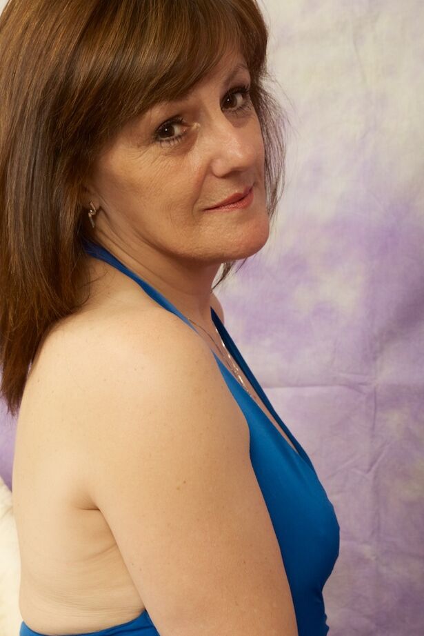 20P Slender hot granny Pandora bares small tits & asshole & poses on her knees