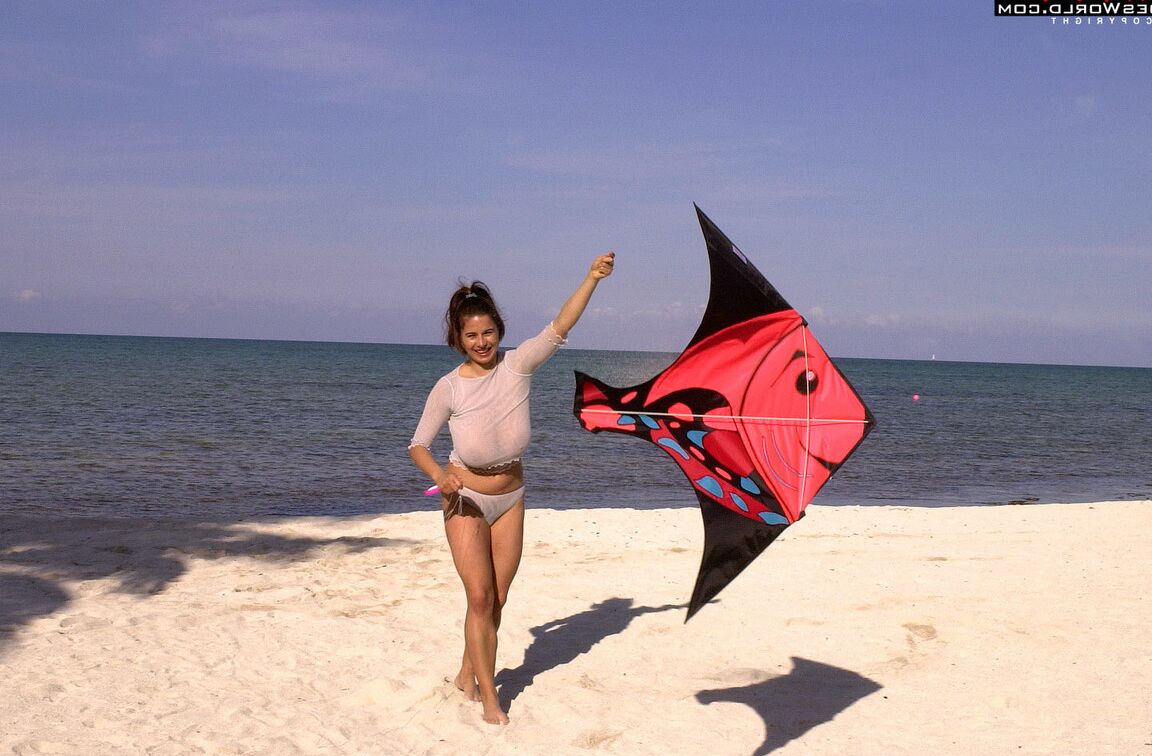 16P Super busty Chloe Vevrier letting her massive big tits hang loose at the beach