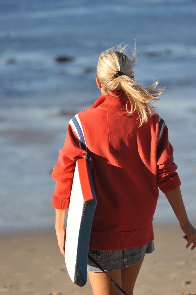 12P Blond female Jenni C puts down her board and exposes her tits and twat instead