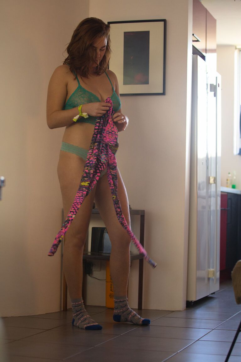 17P White female in striped socks pulls on a thong as she gets dressed
