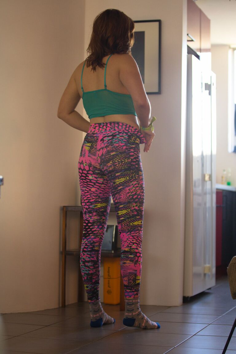 17P White female in striped socks pulls on a thong as she gets dressed