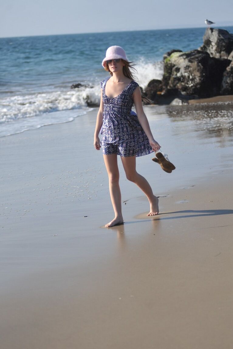 12P Glamour girl Sarah James flashes her upskirt underwear while at the seaside