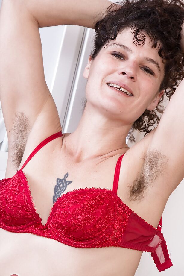 16P Leggy older lady Sunshine loosing really hairy cunt from skirt in kitchen