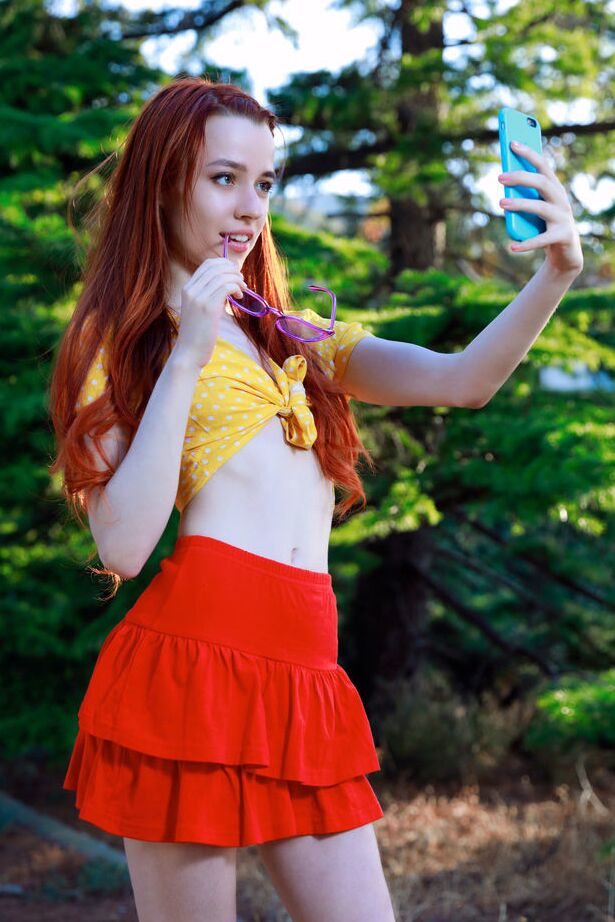 18P Young redhead Sherice gets totally naked after taking selfies on a forest path