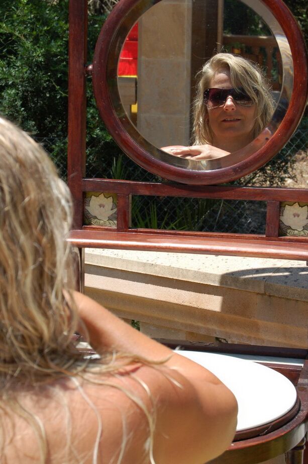 20P Mature blonde Sweet Susi is doused in water by a lesbian while smoking