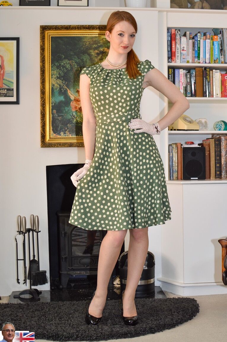 15P Clothed redhead hikes polka dot dress to flash retro undies and hose in gloves