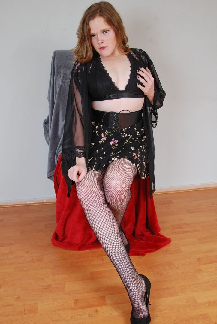 16P Natural redhead exposes her black underwear during upskirt action in nylons