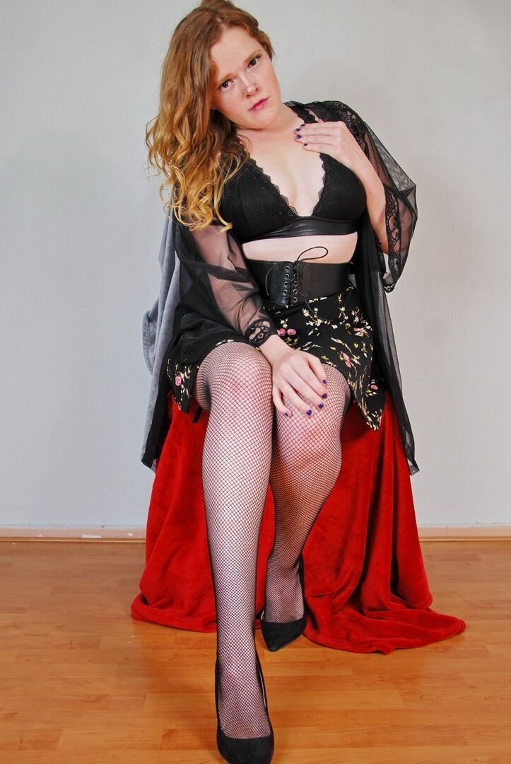 16P Natural redhead exposes her black underwear during upskirt action in nylons