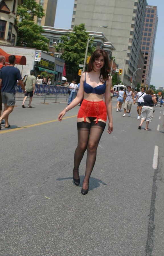 12P Amateur model wanders a public street in her underthings and a girdle