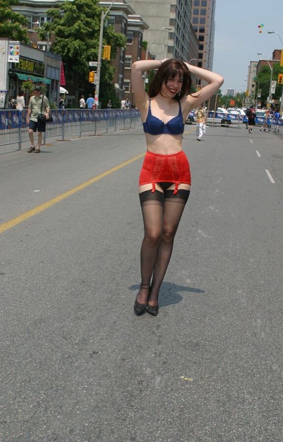 12P Amateur model wanders a public street in her underthings and a girdle