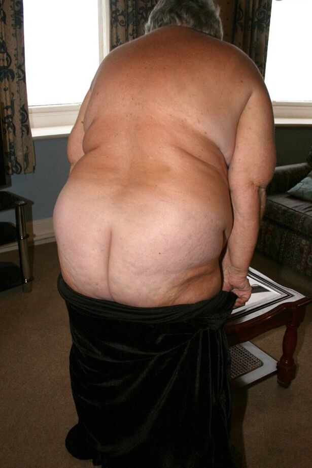 20P Obese UK senior citizen Grandma Libby goes naked on a loveseat in stockings