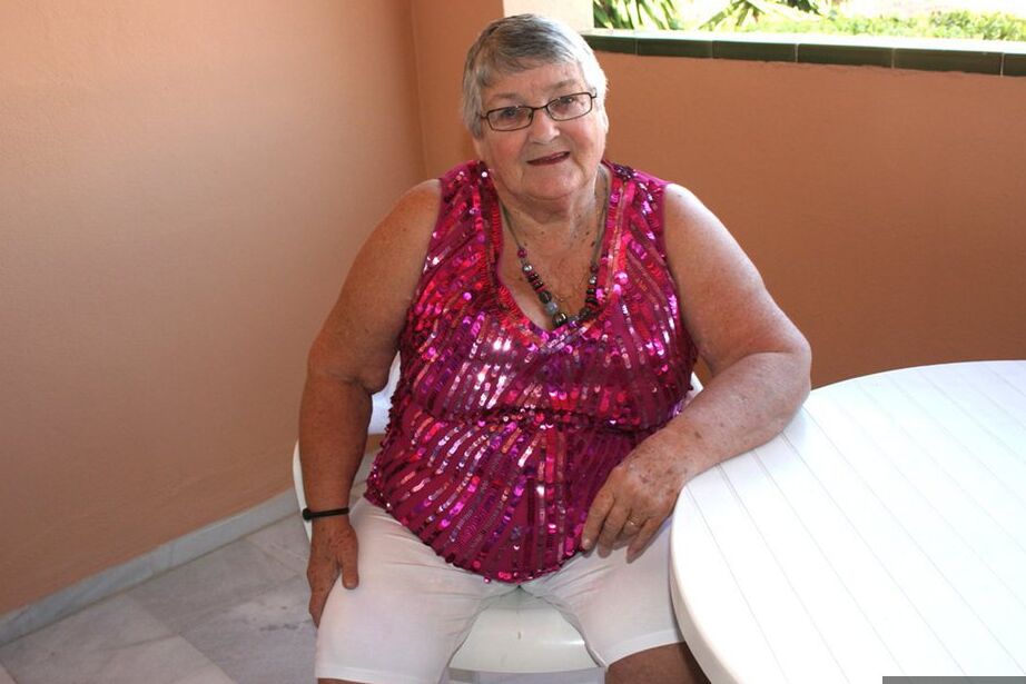 20P Obese grandmother GrandmaLibby parts her labia lips after disrobing on balcony