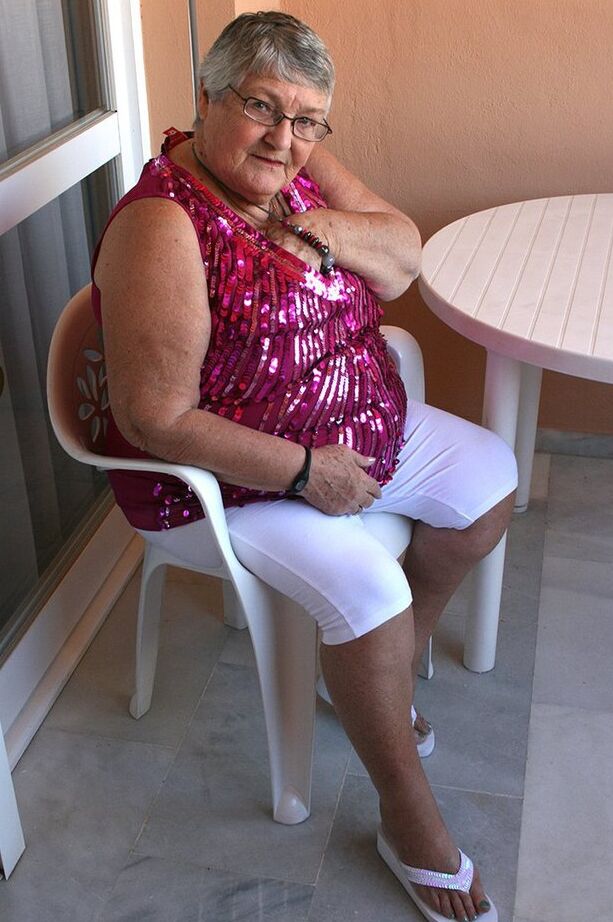 20P Obese grandmother GrandmaLibby parts her labia lips after disrobing on balcony