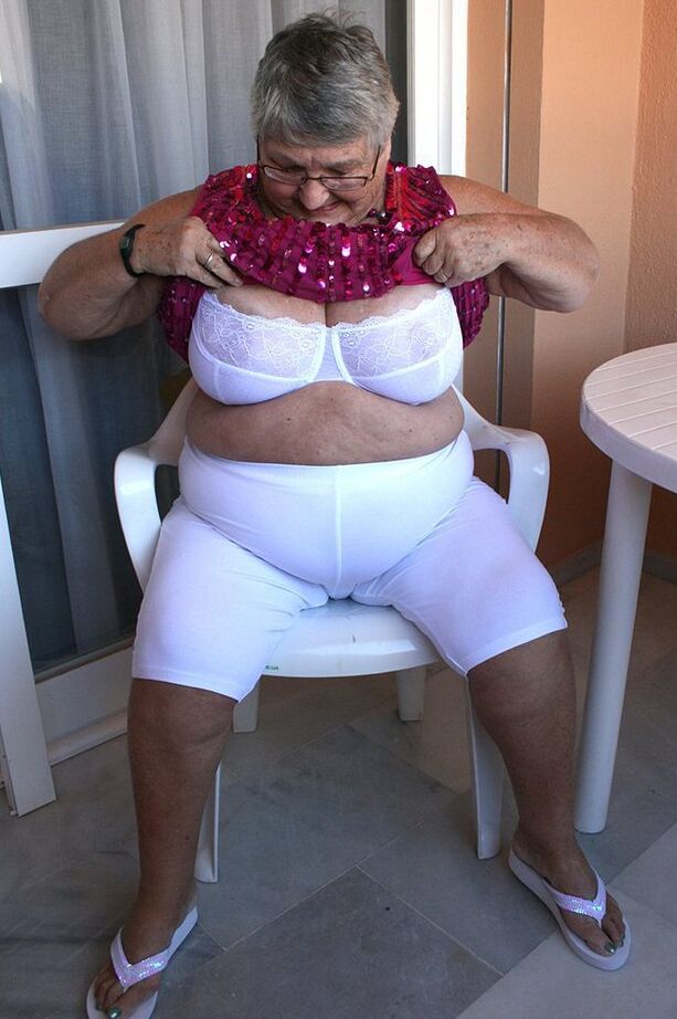 20P Obese grandmother GrandmaLibby parts her labia lips after disrobing on balcony