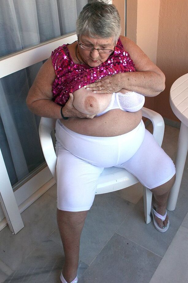 20P Obese grandmother GrandmaLibby parts her labia lips after disrobing on balcony