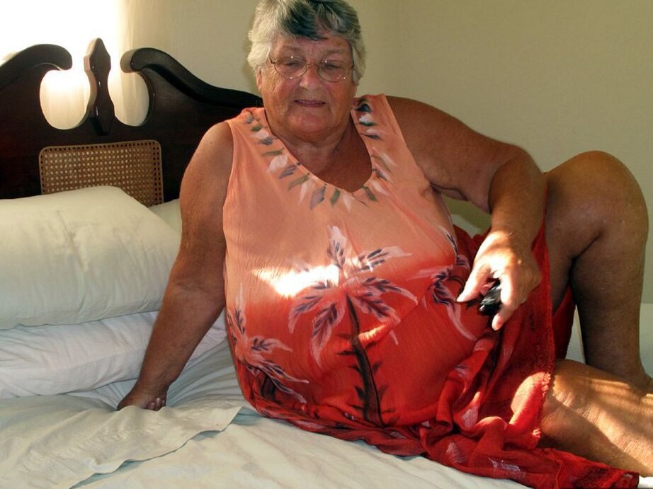 20P Fat old Grandma Libby licking her big nipples while spreading nude for closeup