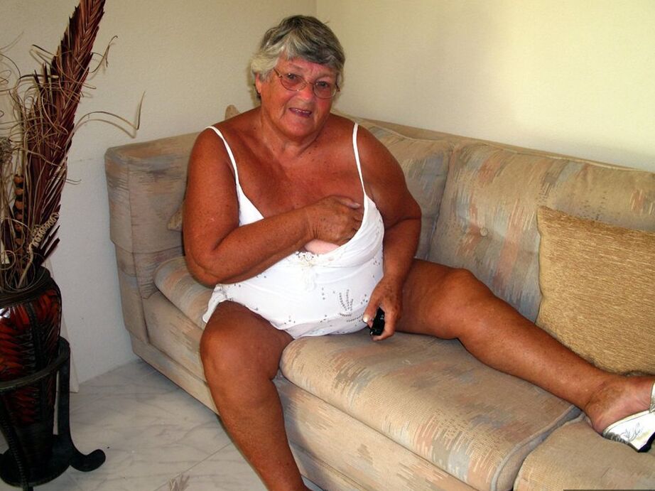 20P Fat lady Grandma Libby bares her saggy tits and big ass while on a couch